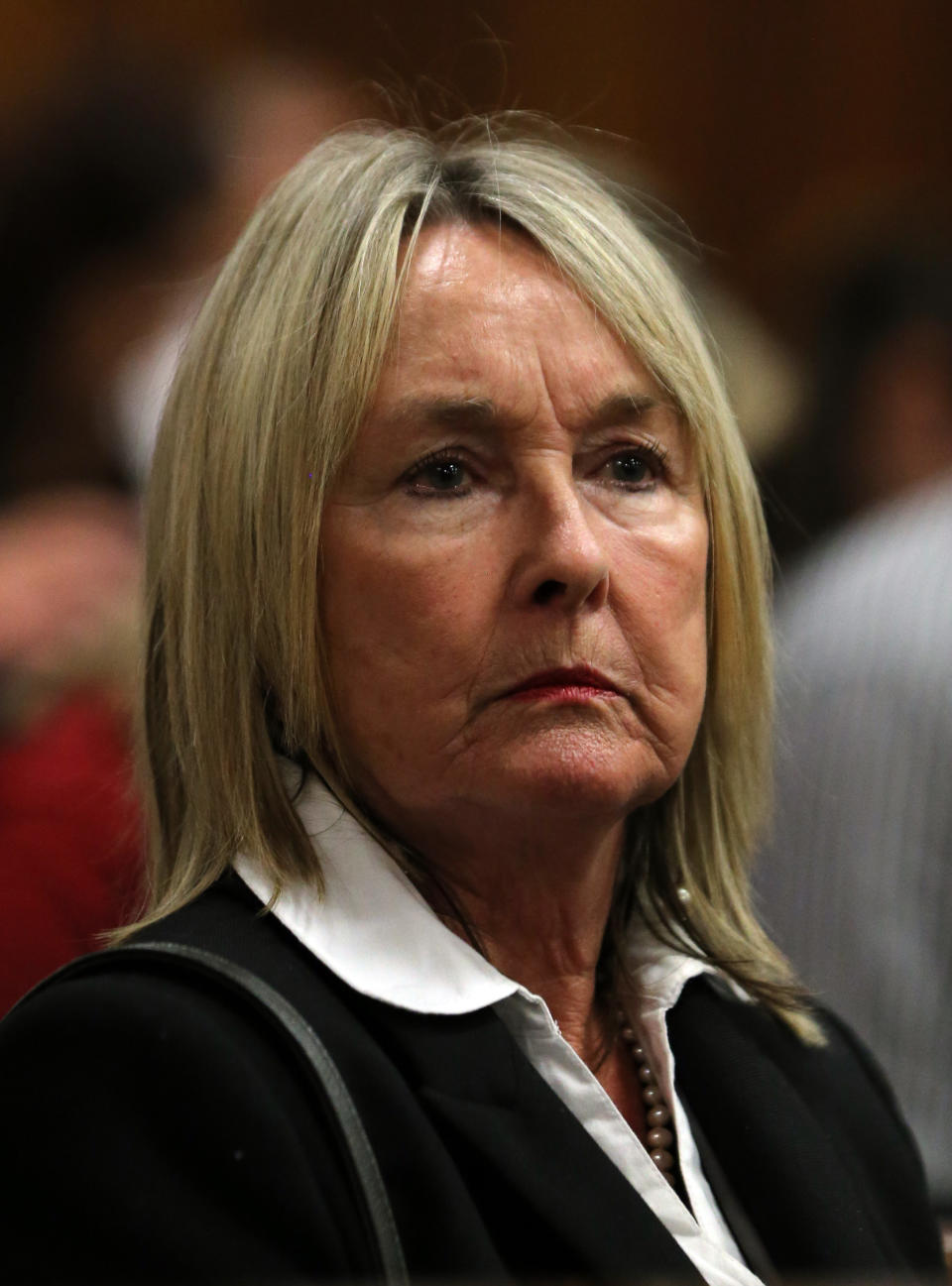 June Steenkamp, mother of the late Reeva Steenkamp listens to evidence by a pathologist during the murder trial of Oscar Pistorius in court in Pretoria, South Africa, Monday, April 7, 2014. Pistorius is charged with murder for the shooting death of his girlfriend Reeva Steenkamp, on Valentines Day 2013. (AP Photo/Themba Hadebe, Pool)