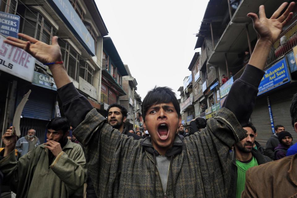 Supporters of Jammu Kashmir Liberation Front (JKLF) shout pro freedom slogans during a protest in Srinagar, India, Friday, March 7, 2014. Dozens of Muslim students from the disputed Indian territory of Kashmir were expelled from their university and briefly threatened with sedition charges because they cheered for the Pakistani cricket team during a televised match against archrival India, police said Thursday, while the Indian state's elected leader called for leniency. (AP Photo/Dar Yasin)