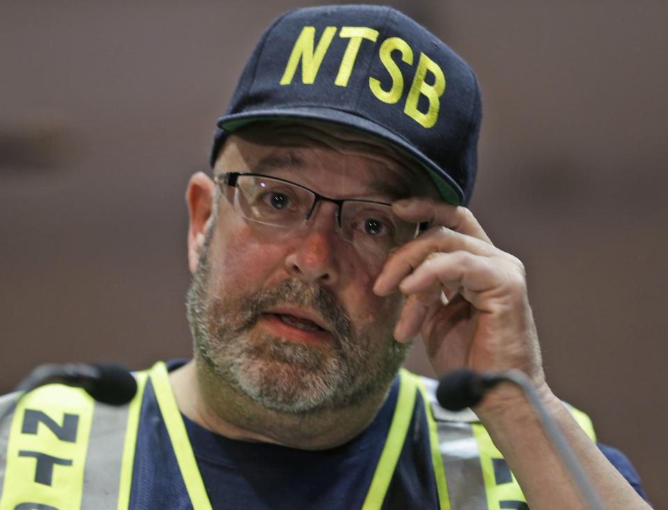 NTSB lead investigator, James Southworth, adjusts his glasses as he address the media during a news conference in Lynchburg, Va., Thursday, May 1, 2014. Southworth will lead the investigation into a CSX oil train derailment near downtown yesterday. Department of Environmental Quality spokesman Bill Hayden said state workers smelled oil downstream from the derailment site during a night-time survey. CSX crews and heavy equipment contractors worked to clear more than a dozen derailed train cars, some carrying crude oil. Two cranes were lifting derailed cars and moving them to a new track. (AP Photo/Steve Helber)