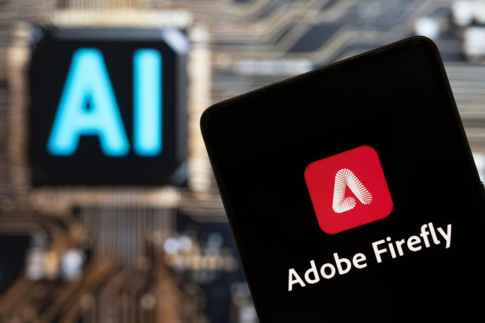 CHINA - 2023/11/10: In this photo illustration, the Adobe Firefly logo is seen on a smartphone with an Artificial intelligence (AI) chip and symbol in the background. (Photo Illustration by Budrul Chukrut/SOPA Images/LightRocket via Getty Images)