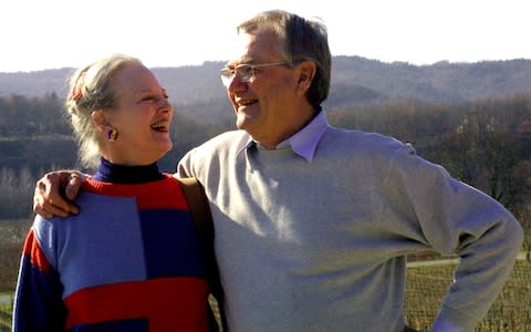 Denmark's Queen Margrethe smiles to her French-born husband Prince Henrik in their residence of Chateau de Caix, southwestern France in 2002 - Credit: AP