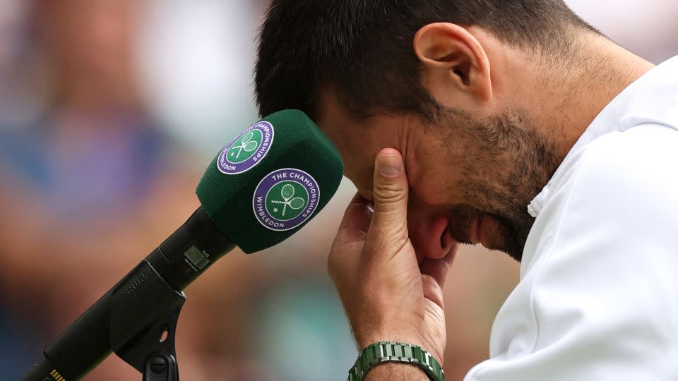 Djokovic was in tears during the trophy presentation after seeing his son, saying it was "nice to see my son still up there, smiling." - Adrian Dennis/AFP/Getty Images