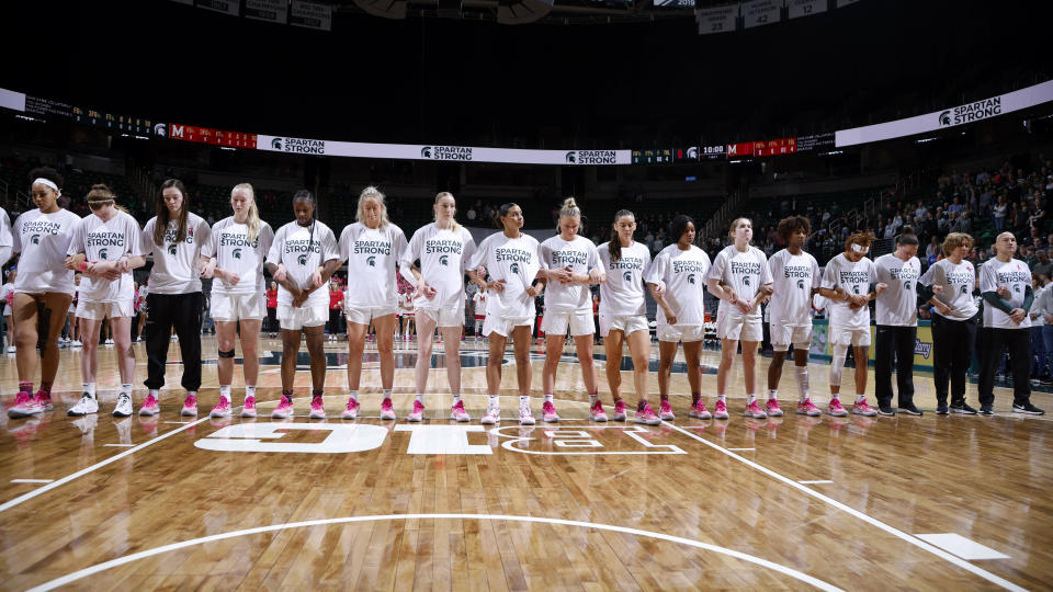 Michigan State players and staff stand together before an NCAA college basketball game against Maryland, Saturday, Feb. 18, 2023, in East Lansing, Mich. (AP Photo/Al Goldis)