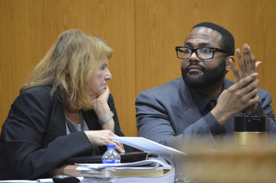 Defense attorney Alison Steiner, left, confers with her client, Willie Cory Godbolt, Wednesday, Feb. 26, 2020, on Day 11 during the penalty phase of his capital murder trial at the Pike County Courthouse in Magnolia, Miss. Godbolt, 37, is on trial, for the May 2017 shooting deaths of eight people in Brookhaven. (Donna Campbell/The Daily Leader via AP, Pool)