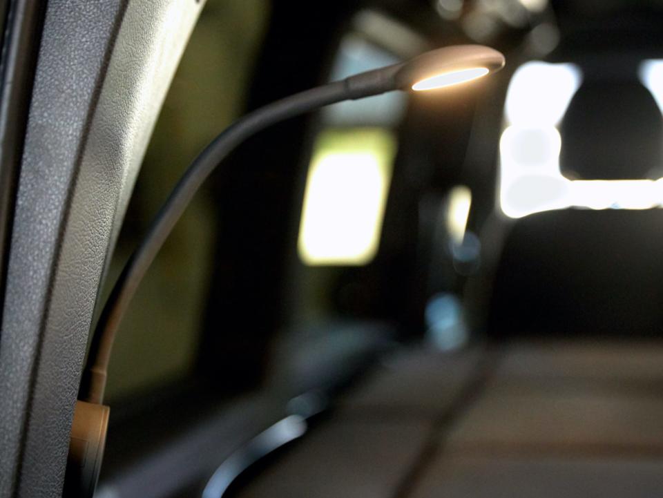 A light inside the van while the seats are all down.