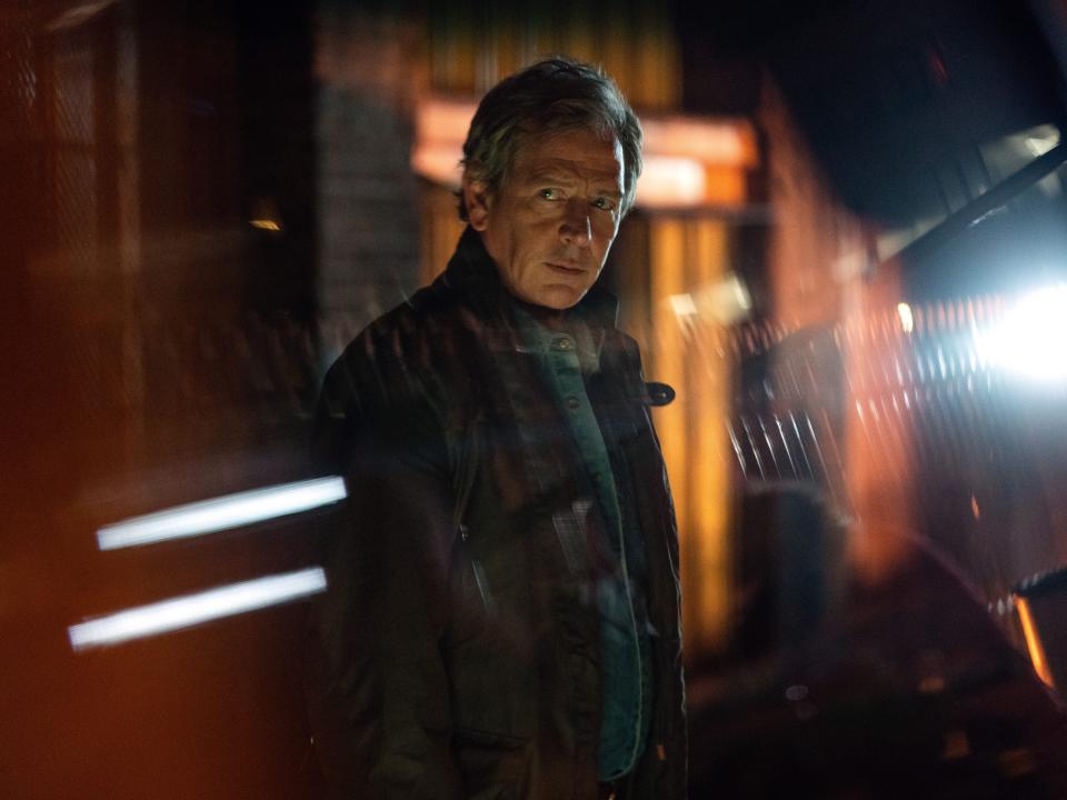 Ben Mendelsohn stares into distance with what appears to be a reflection from a window in the foreground on "Secret Invasion."