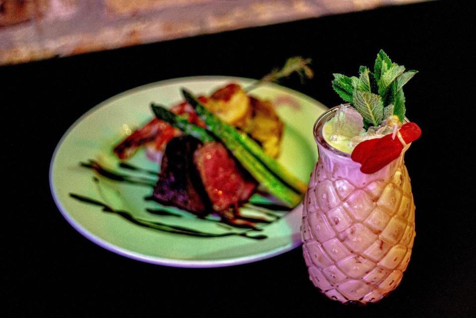 The Surf and Turf at Station No. 06 is a tiki drink garnished with a gummy-candy lobster.