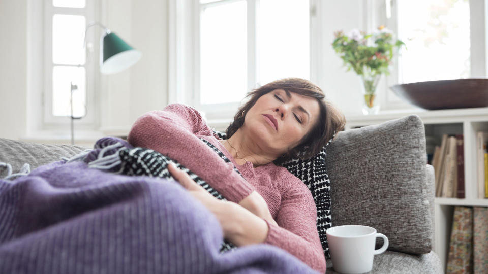 senior woman asleep on a couch