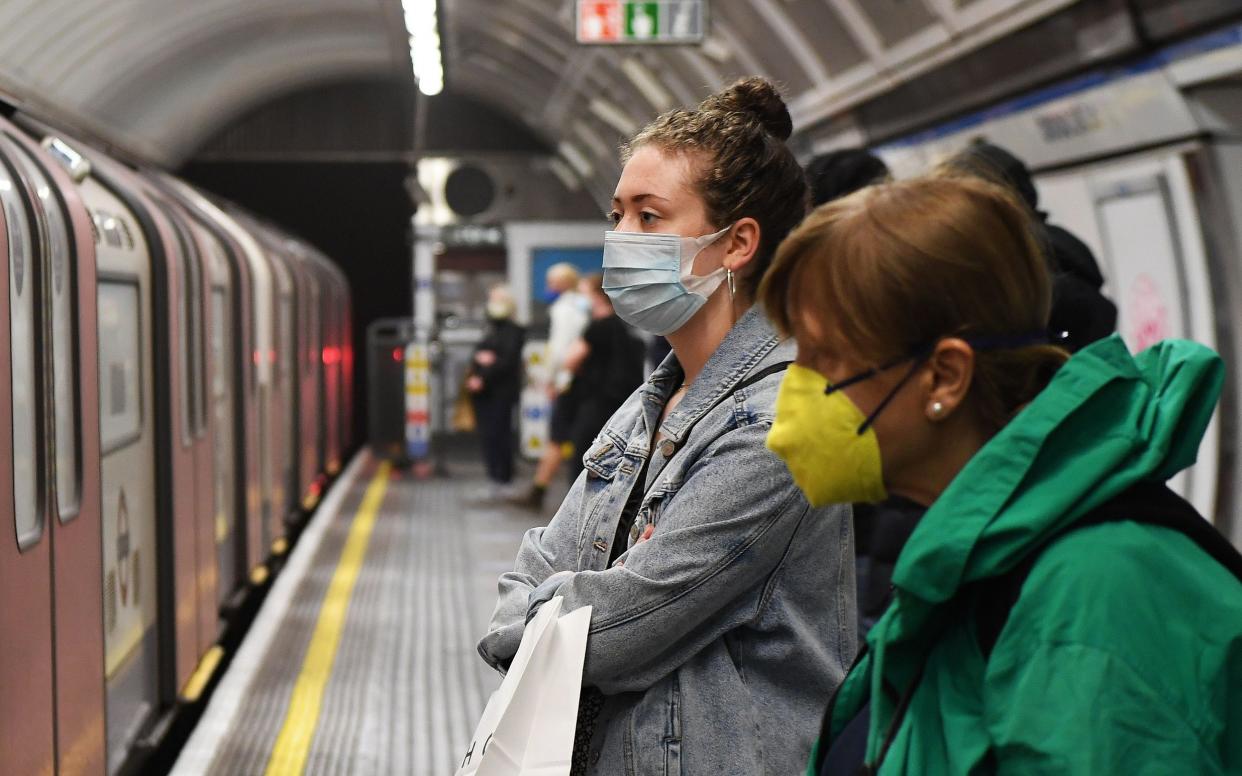 Commuters on the tube in London - Andy Rain/EPA-EFE