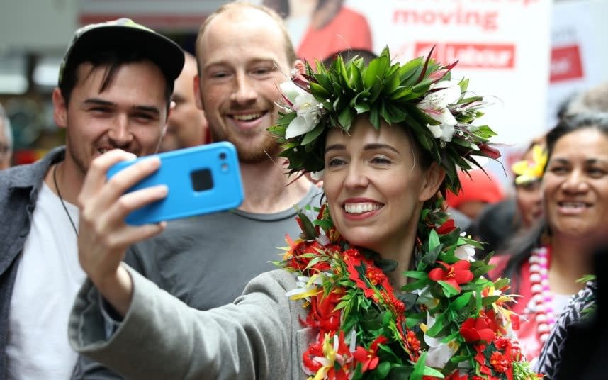 Jacinda Ardern obliges with a selfie while campaigning - FIONA GOODALL/REUTERS