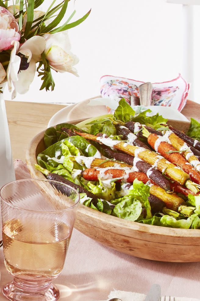 <p>You can put your own twist on this recipe by choosing between créme fraîche or sour cream to make the dressing. Both are equally delicious.</p><p><strong><a href="https://www.countryliving.com/food-drinks/a26784279/green-salad-roasted-carrots-creamy-tarragon-dressing-recipe/" rel="nofollow noopener" target="_blank" data-ylk="slk:Get the recipe;elm:context_link;itc:0;sec:content-canvas" class="link ">Get the recipe</a>.</strong></p><p><strong><a class="link " href="https://go.redirectingat.com?id=74968X1596630&url=https%3A%2F%2Fwww.walmart.com%2Fip%2FLipper-International-Inc-Acacia-Wave-Large-Wooden-Finish-Salad-Serving-Bowl%2F23209691&sref=https%3A%2F%2Fwww.countryliving.com%2Ffood-drinks%2Fg34470406%2Fvegetarian-christmas-dinner%2F" rel="nofollow noopener" target="_blank" data-ylk="slk:SHOP SALAD BOWLS;elm:context_link;itc:0;sec:content-canvas">SHOP SALAD BOWLS</a><br></strong></p>