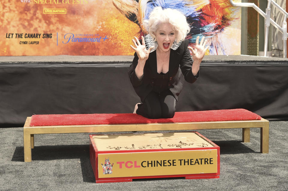 Cyndi Lauper poses during a hand and footprint ceremony on Tuesday, June 4, 2024, at the TCL Chinese Theatre in Los Angeles. (Photo by Richard Shotwell/Invision/AP)