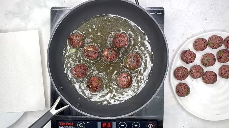 frying 'meatballs' in pan