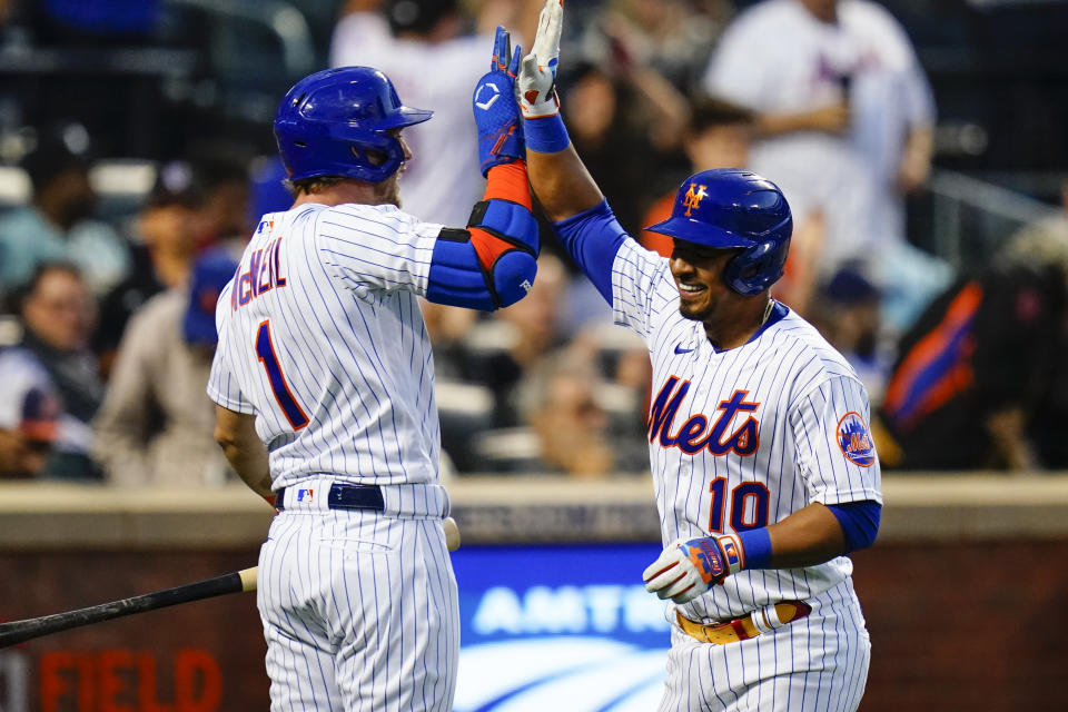 New York Mets' Eduardo Escobar (10) celebrates with Jeff McNeil (1) after hitting a home run during the fourth inning in the second baseball game of a doubleheader against the St. Louis Cardinals Tuesday, May 17, 2022, in New York. (AP Photo/Frank Franklin II)