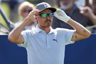 Rickie Fowler adjusts his sunglasses as he waits to tee off on the third hole during a practice round for The Players Championship golf tournament Wednesday, March 13, 2024, in Ponte Vedra Beach, Fla. (AP Photo/Chris O'Meara)