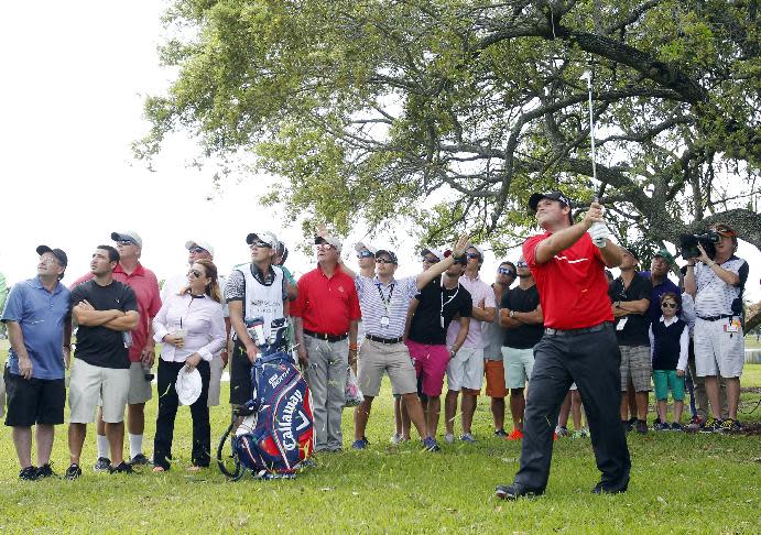 Patrick Reed watches his shot from the rough on the seventh hole during the final round of the Cadillac Championship golf tournament on Sunday, March 9, 2014, in Doral, Fla. (AP Photo/Wilfredo Lee)