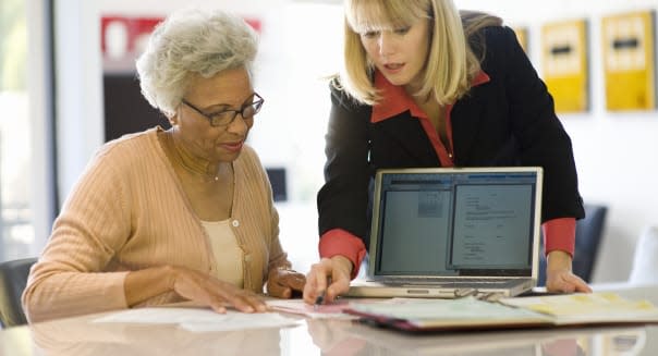Financial Advisor Assisting Senior Woman