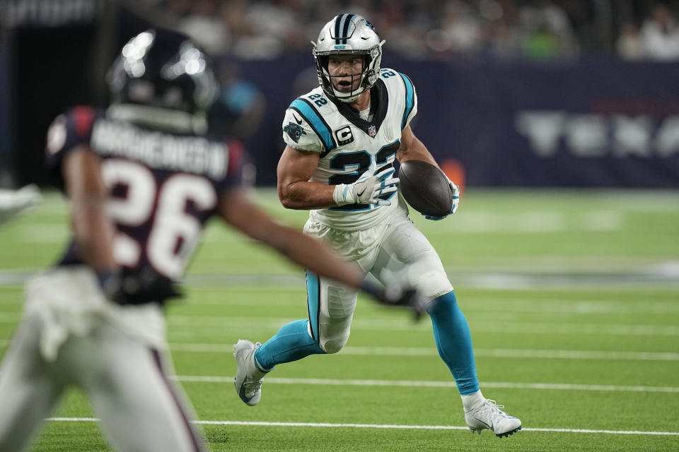 Carolina Panthers running back Christian McCaffrey (22) rushes for a gain as Houston Texans cornerback Vernon Hargreaves III (26) defends during the first half of an NFL football game Thursday, Sept. 23, 2021, in Houston. (AP Photo/Eric Christian Smith)