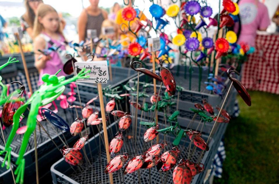 Frogs, lady bugs, grasshoppers and more at the Metal Illusions booth at the People’s Choice Festival on Friday, July 14, 2023.