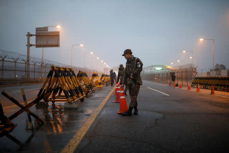 South Korean soldiers stand guard at a check point on the Grand Unification Bridge that leads to the truce village of Panmunjom, just south of the demilitarized zone separating the two Koreans, in Paju, South Korea, January 15, 2018. REUTERS/ Kim Hong-ji
