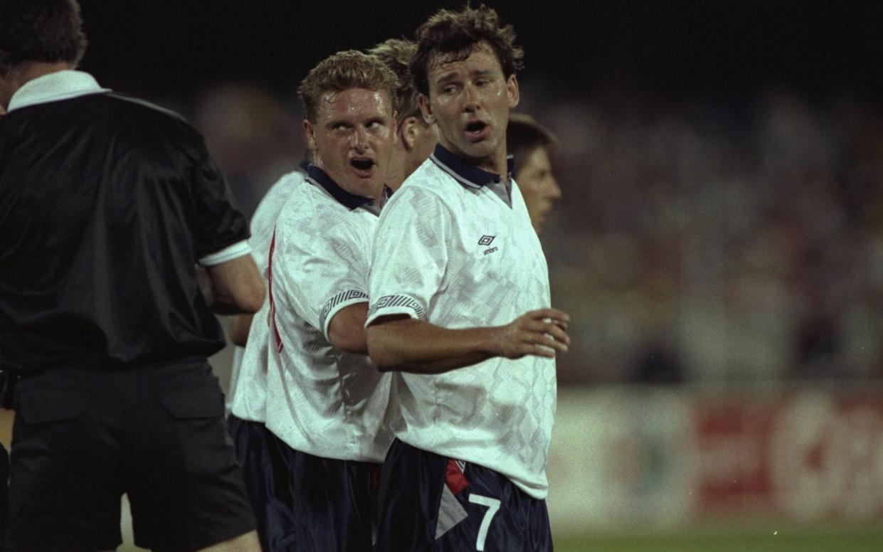 Bryan Robson #7 of England looks on as Paul Gascoigne (centre) of England sneers at the referee during the World Cup match against the Republic of Ireland in Cagliari, Italy