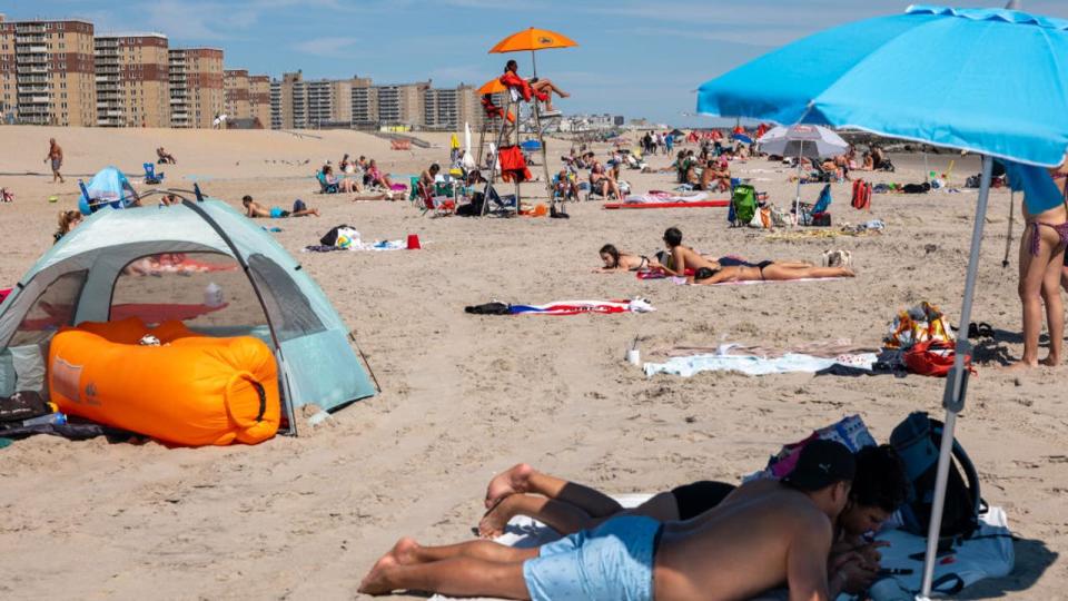 <div>People enjoy a day at Rockaway Beach. <strong>(Photo by Spencer Platt/Getty Images)</strong></div>