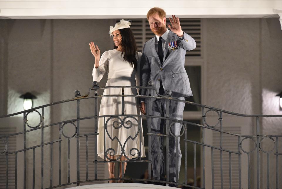 Prince Harry and Meghan Markle waved to locals. Photo: Getty