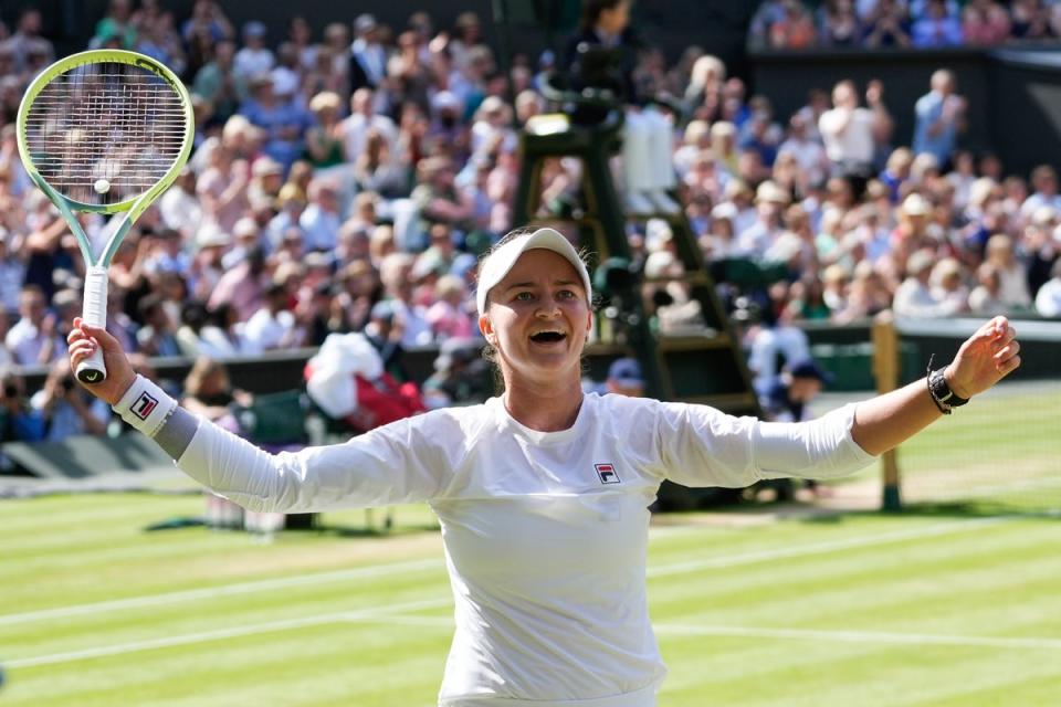 Krejcikova raises her arms aloft at the moment of triumph (AP)