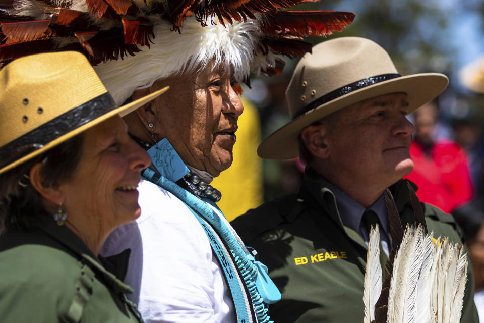 Jan Balsom, left, Havasupai ceremonial practitioner Uqualla and Grand Canyon National Park Superintendent Ed Keable pose for a photograph Thursday, May 4, 2023, at the park's South Rim. The Havasupai Tribe and the park marked the renaming of a popular campground below the rim from Indian Garden to Havasupai Gardens. (AP Photo/Ty O'Neil)