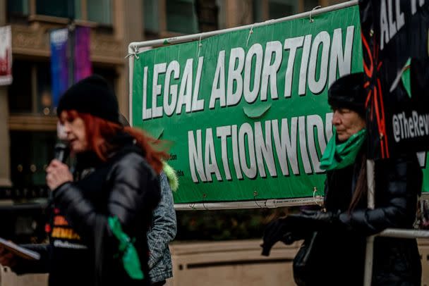 PHOTO: Demonstrators hold a sign during a protest against Walgreens on International Women's Day in Chicago, March 8, 2023. (Jamie Kelter Davis/Bloomberg via Getty Images)