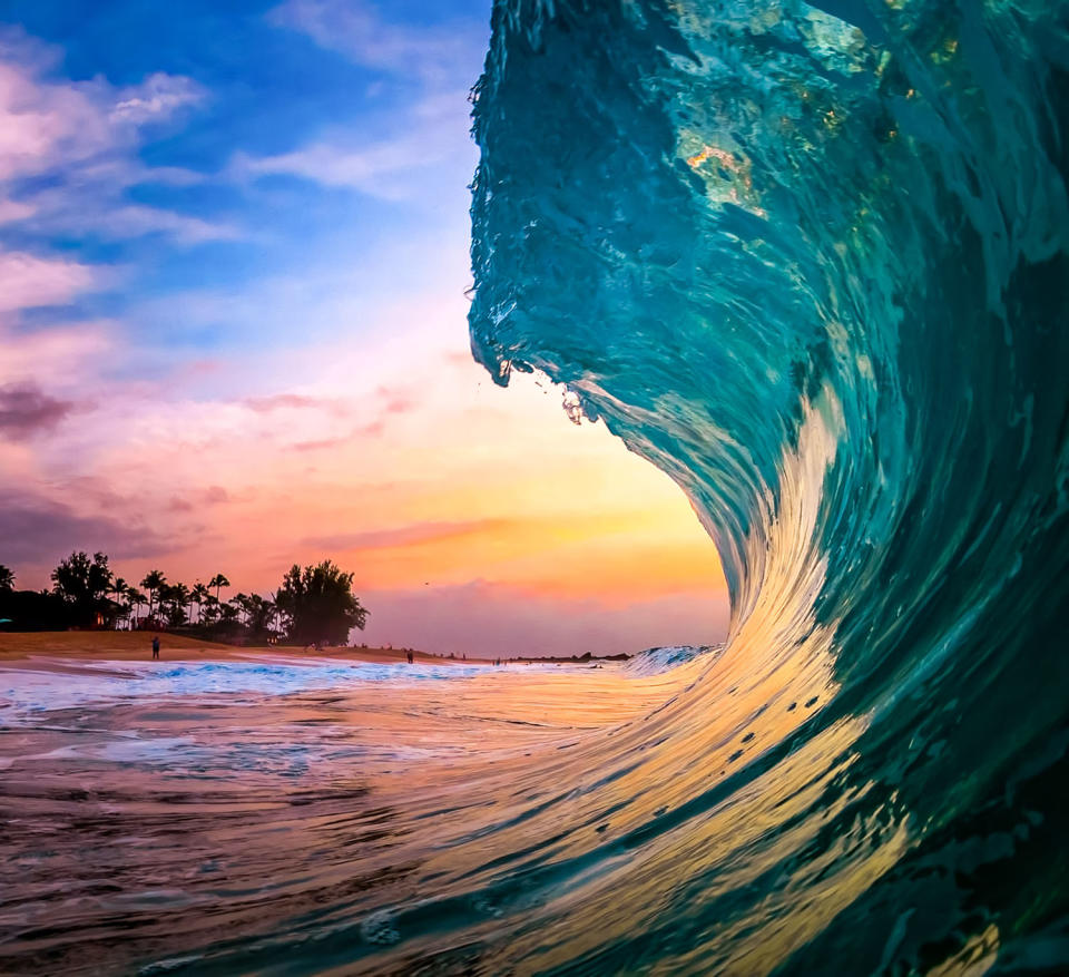 Smooth waves bursting with color give inside view of surfer’s paradise