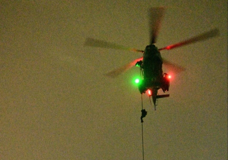 Special Operations Task Force members fast-roping from RSAF's H225M medium lift helicopter to the roof of The Star Vista. (PHOTO: Singapore Armed Forces)