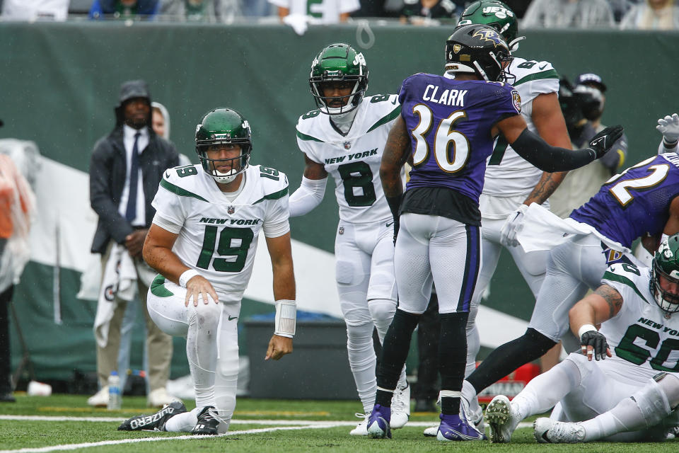 New York Jets' Elijah Moore (8) helps up quarterback Joe Flacco (19) after Flacco threw an interception during the first half of an NFL football game against the Baltimore Ravens, Sunday, Sept. 11, 2022, in East Rutherford, N.J. (AP Photo/John Munson)