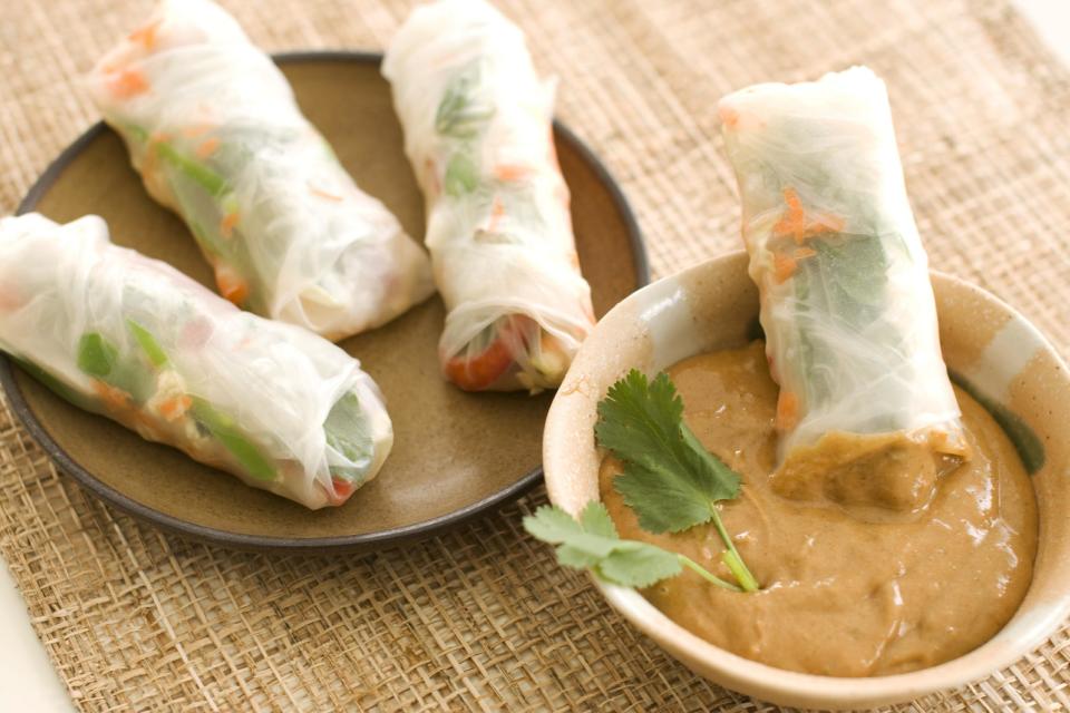 In this image taken on May 13, 2013, summer rolls with spicy peanut dipping sauce are shown served on a plate in Concord, NH. (AP Photo/Matthew Mead)