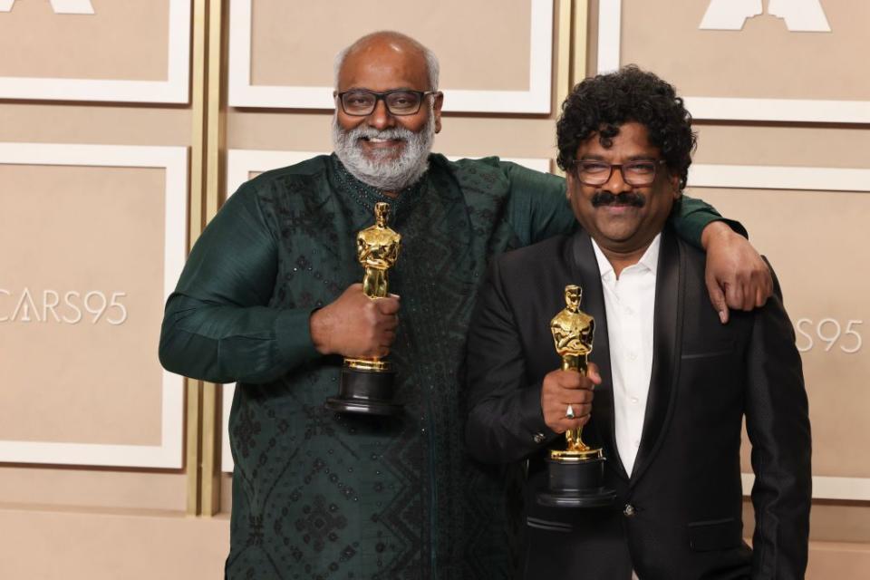 HOLLYWOOD, CALIFORNIA - MARCH 12: M.M. Keeravaani and Chandrabose, winners of Best Music (Original Song) award for ’RRR’, pose in the press room during the 95th Annual Academy Awards at Ovation Hollywood on March 12, 2023 in Hollywood, California. (Photo by Rodin Eckenroth/Getty Images)