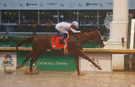 May 5, 2018; Louisville, KY, USA; Mike Smith aboard Justify (7) crosses the finish line to win the 144th running of the Kentucky Derby at Churchill Downs. Mandatory Credit: Jerry Lai-USA TODAY Sports