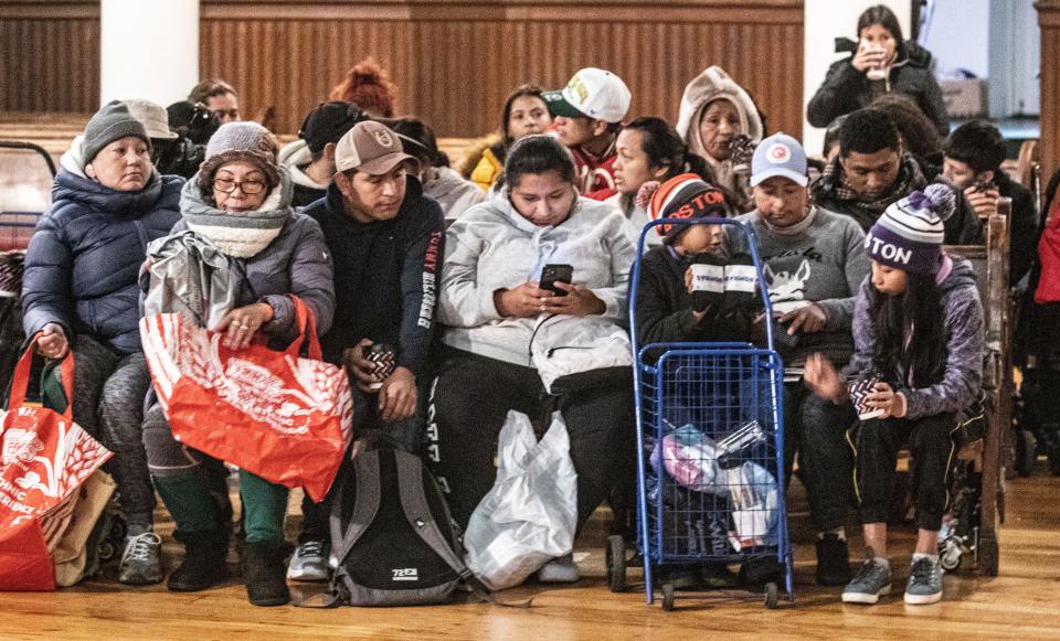 Asylum seekers wait inside St. Paul and St. Andrew United Methodist Church in Manhattan on Oct. 16, 2023, where they were seeking support from Venezuelans and Immigrants Aid, a nonprofit organization that provides assistance to asylum-seekers.