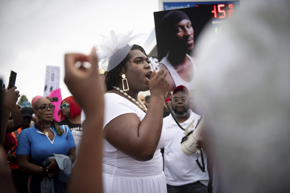 CORRECTS SECOND SENTENCE - Queen Jean, of Trans-Liberation, speaks during a vigil to memorialize O'Shae Sibley at a gas station on Friday, Aug. 4, 2023, in the Brooklyn borough of New York. Sibley, a gay man, was fatally stabbed at the gas station after a confrontation between a group of friends dancing to a Beyoncé song and several young men who taunted them. (AP Photo/Tracie Van Auken)