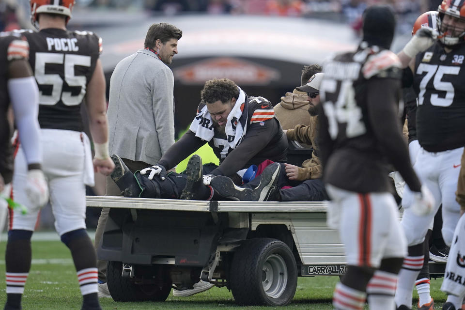 FILE - Cleveland Browns offensive tackle Jedrick Wills Jr. is carted off the field during the second half of an NFL football game against the Arizona Cardinals on Nov. 5, 2023, in Cleveland. The Browns lost their second starting tackle in two days as Jedrick Wills Jr. underwent season-ending knee surgery. Wills had been on injured reserve since Nov. 7, and the team had hoped he would be able to return at some point this season.(AP Photo/Sue Ogrocki, File)