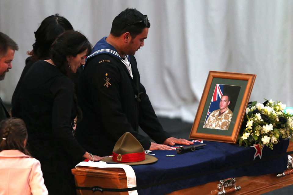 CHRISTCHURCH, NEW ZEALAND - AUGUST 25: Family members of Corporal Luke Tamatea pay their respect during a combined memorial service for fallen soldiers Corporal Luke Tamatea, Lance Corporal Jacinda Baker and Private Richard Harris at Burnham Military Camp on August 25, 2012 in Christchurch, New Zealand. The three fallen New Zealand soldiers were fatally wounded in action on August 4, 2012, in the Bayman Province in Afghanistan. (Photo by Martin Hunter/Getty Images)