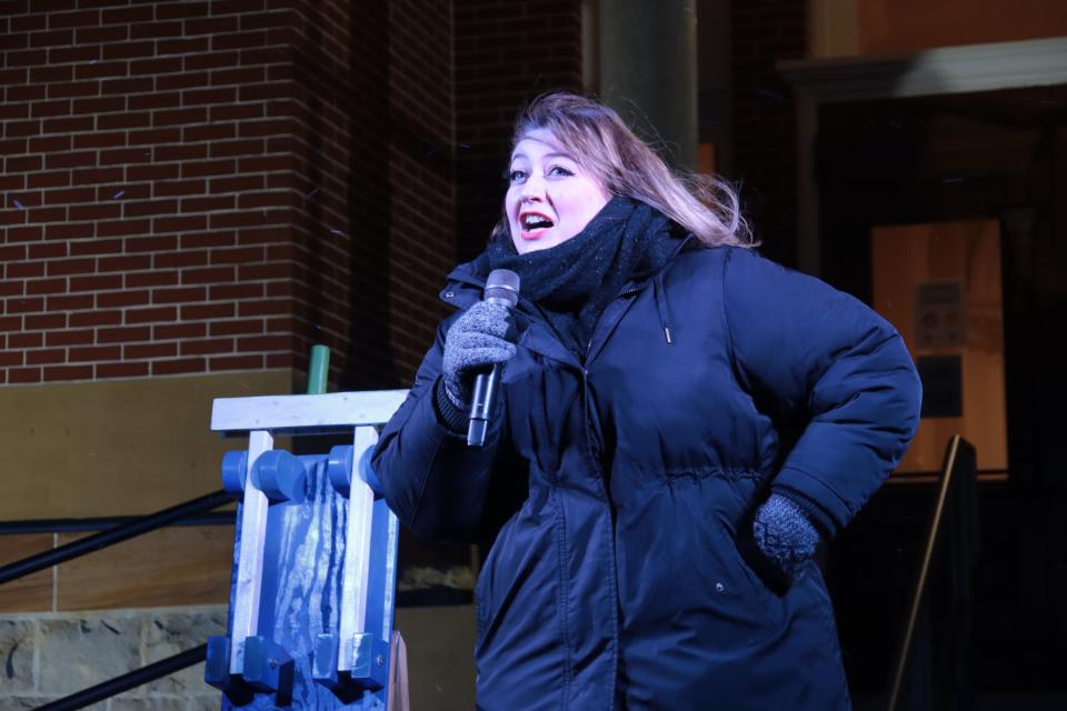 Natasha Ricketts sings "Rockin' Around the Christmas Tree" Monday during the ceremony to light the Community Christmas Tree at the old Lenawee County Courthouse.