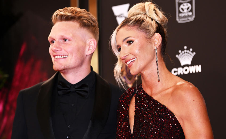 Western Bulldogs player Adam Treloar, pictured here with netball star Kim Ravaillion.