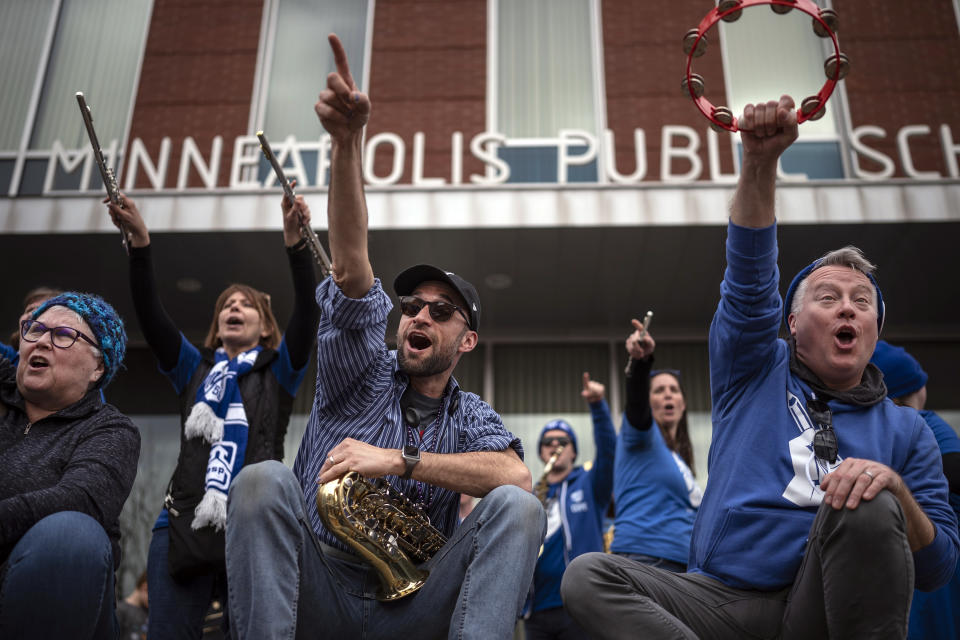 Minneapolis teachers gather in front of the Davis Center to picket on the 10th day of the teachers strike in Minneapolis, Monday, March 21, 2022. (Jerry Holt/Star Tribune via AP)