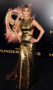 Jennifer Lawrence rocked a golden look at the world premiere of "The Hunger Games" in Los Angeles. Her Prabal Gurung dress included cutout sides and a futuristic metallic sheen, and she paired the gown with Jimmy Choo heels and black diamond earrings. Fans went wild for the star and her style, but Lawrence saved her enthusiasm for something simple -- an opportunity to "sleep in a bed soon."