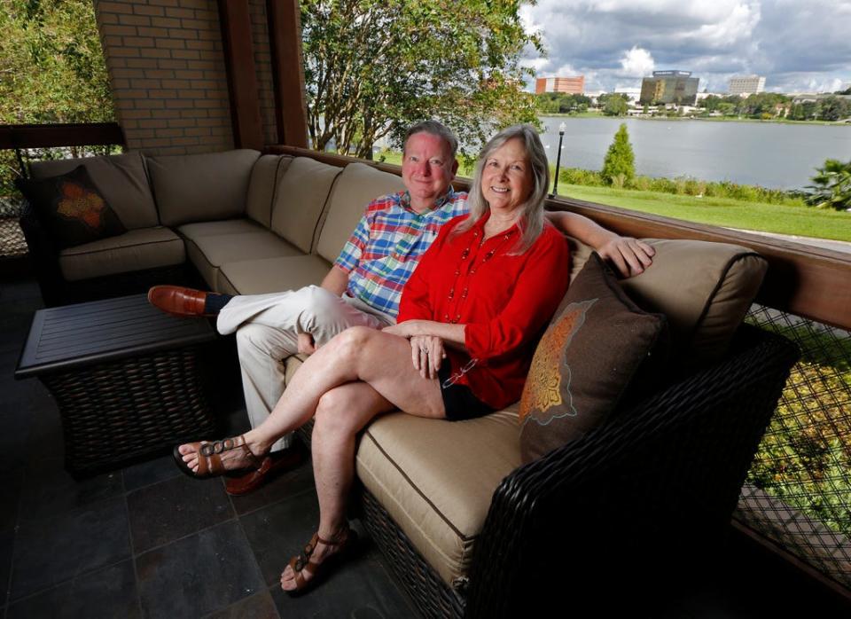 Edie Yates Henderson and David Henderson on the balcony of their home on Lake Morton in 2014.