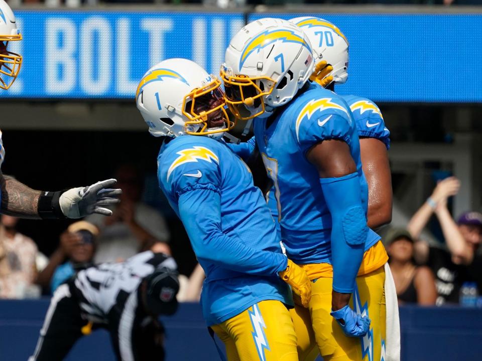 DeAndre Carter celebrates a touchdown with tight end Gerald Everett.