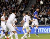 Italy's Graziano Pelle heads to score against England during their international friendly soccer match at Juventus Stadium in Turin March 31, 2015. REUTERS/Giorgio Perottino