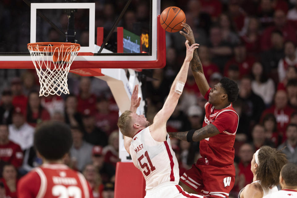 Wisconsin's AJ Storr, right, shoots against Nebraska's Rienk Mast (51) during the first half of an NCAA college basketball game Thursday, Feb. 1, 2024, in Lincoln, Neb. (AP Photo/Rebecca S. Gratz)