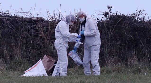 Forensic officers at work on a stretch of coastline near Swanage, discover items of clothing. Source: AAP