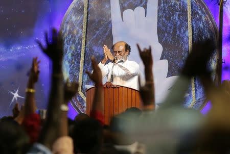 Actor Rajinikanth greets his supporters after announcing the launch of his political party in Chennai, India, December 31, 2017. REUTERS/P. Ravikumar